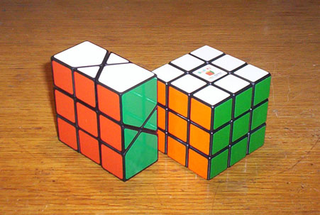 Mini Mental Block next to a standard Rubik's Cube