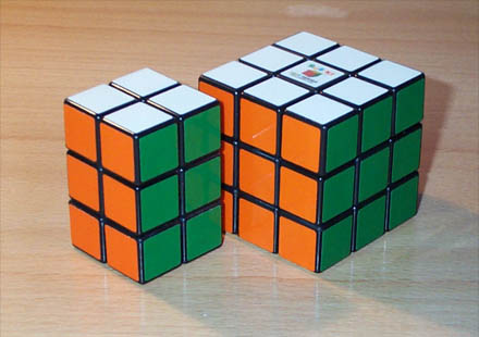 Slim Tower next to a standard Rubik's Cube